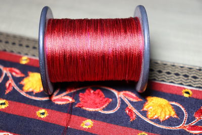 Close-up of red container on table