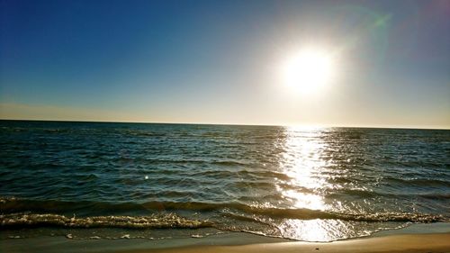 Scenic view of sea against clear sky during sunset