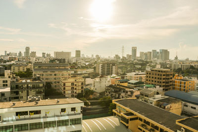 Cityscape against cloudy sky