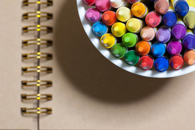 Close-up of multi colored pencils on table
