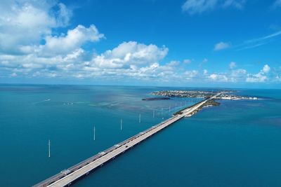 High angle view of sea against blue sky