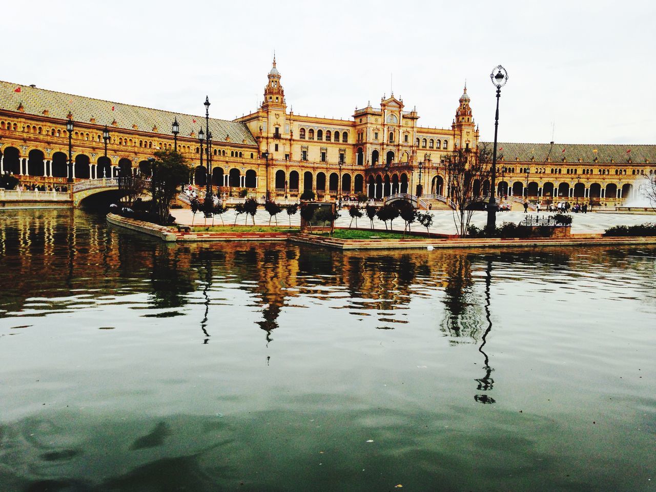 architecture, building exterior, built structure, water, reflection, waterfront, clear sky, city, travel destinations, pond, river, canal, incidental people, famous place, history, tourism, fountain, lake, outdoors, travel