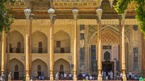 Group of people in front of historical building