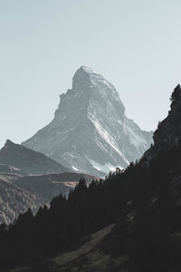 Distant view of matterhorn mountain in switzerland with snow. mountain silhouette.