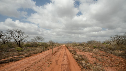 Dirt road along countryside landscape