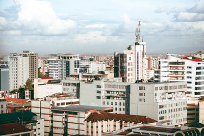 High angle view of buildings in city against sky