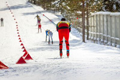 Group skier athletes downhill skiing race