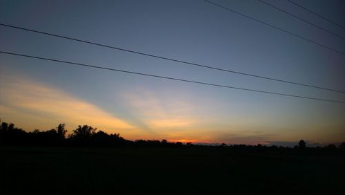 Silhouette landscape against sky during sunset