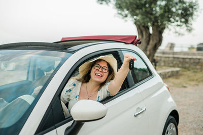 Side view of woman in car