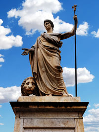 Low angle view of statue against sky