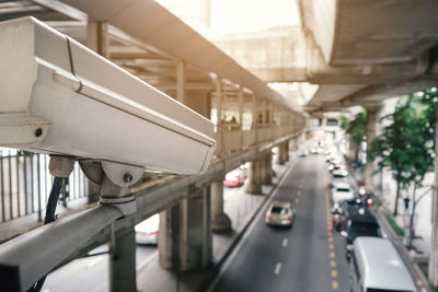 Outdoor security cctv camera in traffic, view from skywalk