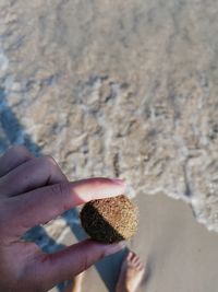 Close-up of hand holding ice cream