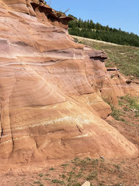 View of rock formations. uneven rough wall of red rock, red canyon in kukmor, russia