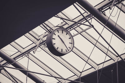 Low angle view of clock on ceiling