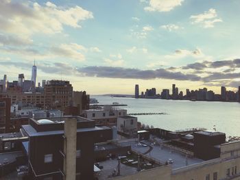 High angle view of buildings against cloudy sky