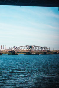 Bridge over sea against sky