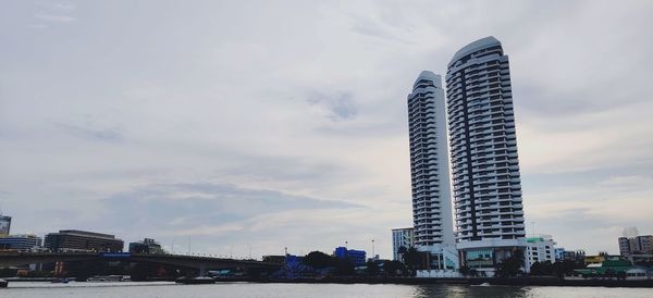 Low angle view of modern buildings against sky in city