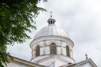 Former brick greek catholic church in werchrata, erected in 1910. the dramatic sky in the background