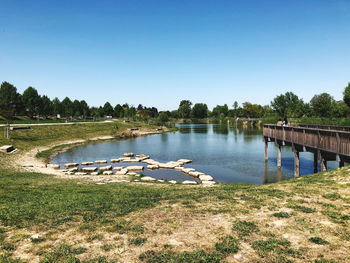 View of bridge over lake against clear sky