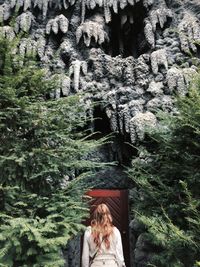 Close-up of buddha statue against trees