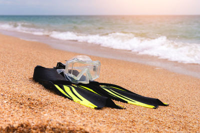 Rear view of woman standing at beach