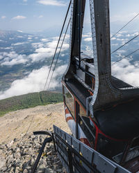 Metallic structure on land against sky