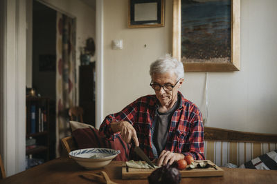 Senior man preparing food at home