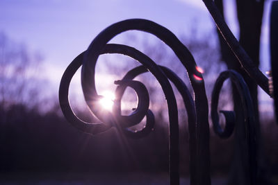 Close-up of metallic structure against sky