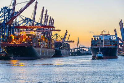 Commercial dock by sea against sky