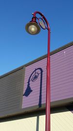 Low angle view of built structure against blue sky