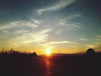 Scenic view of road at sunset