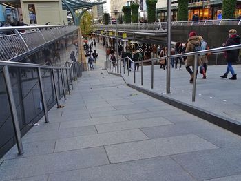 People walking on street in city