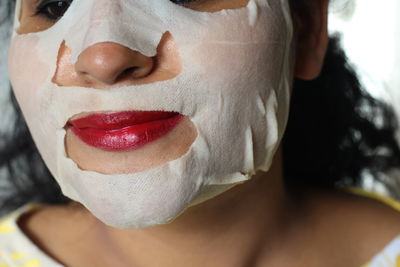 Close-up of woman with facial mask