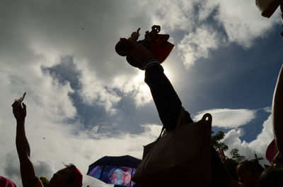 Low angle view of statues against sky