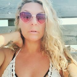 Portrait of young woman wearing sunglasses