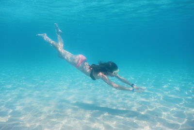 Full length of woman swimming in sea