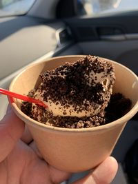 Close-up of hand holding ice cream