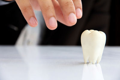 Close-up of hands on table