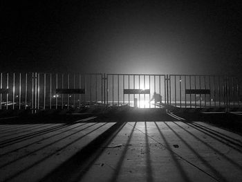 Empty road against clear sky at night