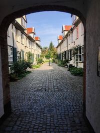 Narrow alley along buildings