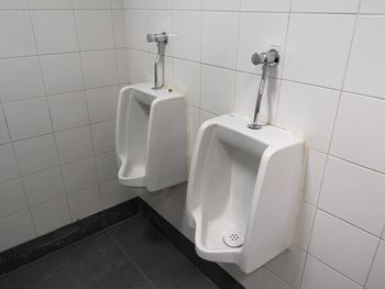 High angle view of urinal in bathroom