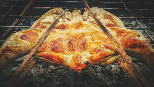 High angle view of meat on barbecue grill