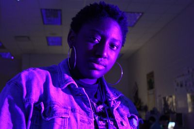 Portrait of teenage girl standing at home