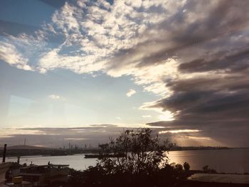 Scenic view of lake against sky at sunset