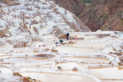 High angle view of people on salt ponds