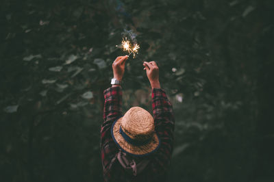 Midsection of woman holding umbrella
