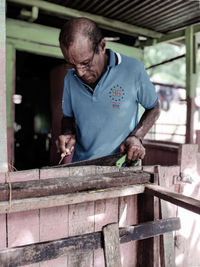 Man working on wood