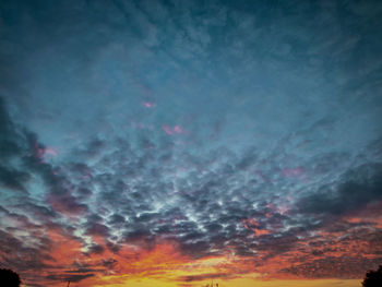 Low angle view of dramatic sky at sunset