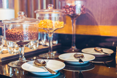 Close-up of wine glasses on table in restaurant