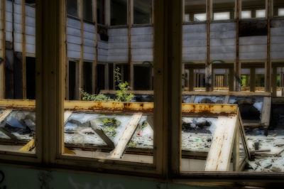 Full frame shot of glass window in abandoned building